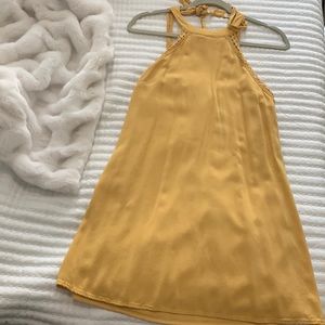 Lined sunburst yellow halter dress